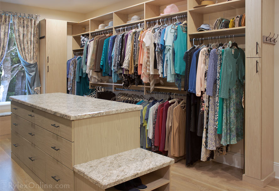 Master Closet with with Closet Island and Shoe Storage