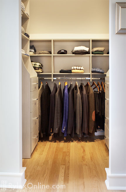 Dual Master Closet Showing Men's Closet with Open Shelving and Hutch