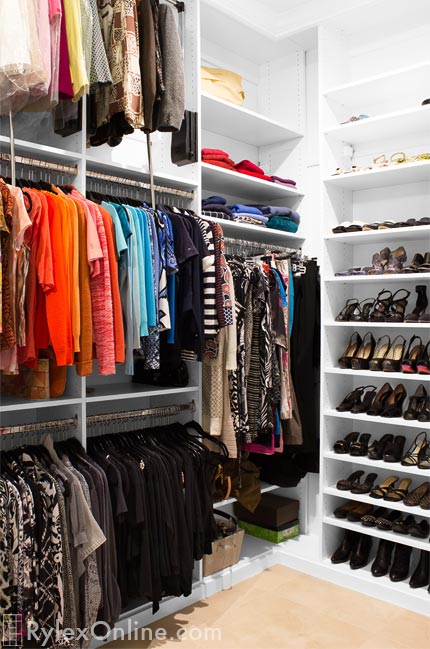 White Walkin Closet with Shoe Storage and Hanging Space