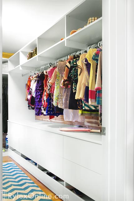 Spacious Girl's Closet with Sliding Shoe Drawer, Cabinet Drawers and Hanging Space