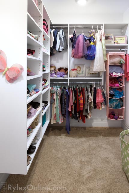 Girls Closet with Spacious Open Shelves and Hanging Rods