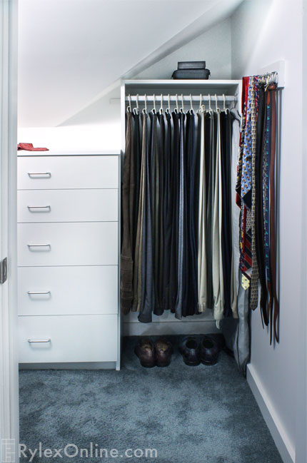 Angled Closet Wall with Pant Hanging Space and Tie Rack
