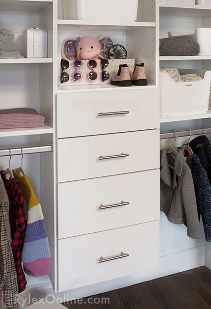 Toddler Closet with Cabinet Drawers and Open Shelves Close Up