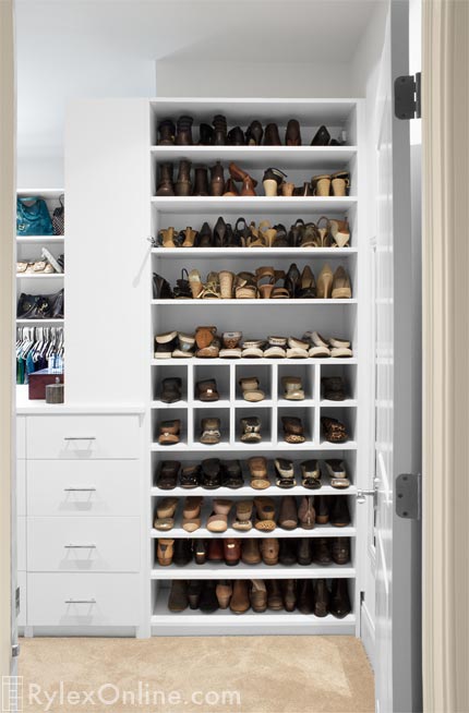 Master Walk-In Closet with Adjustable Shoe Shelves and Shoe Cubbies
