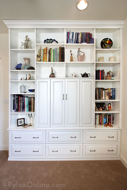 Entertainment Center with Guest Room Storage Drawers and Display Shelves