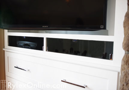 Fireplace Bedroom TV Cabinet with Smoke Glass Doors Concealing Electronics Close Up