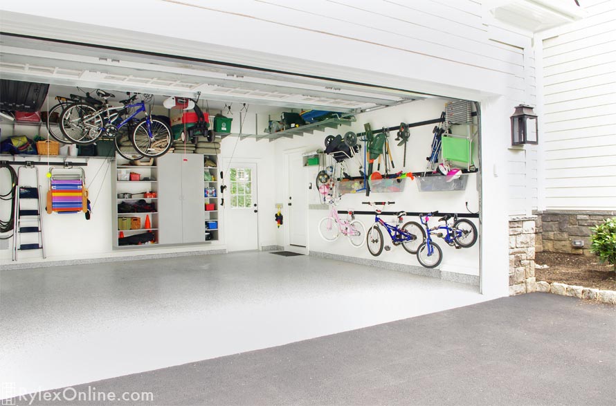 Garage Storage using Fast Track Wall Mounted Systems and Locking Storage Cabinet with Open Shelves