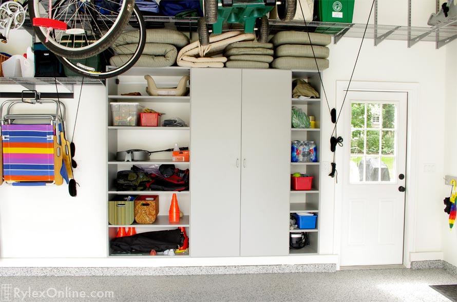 Grey Closed Garage Cabinets with Dual Open Shelves on Each Side