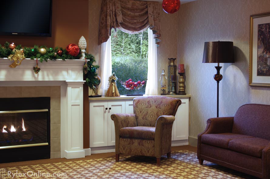 Senior Living Community Room with Corian Topped Fireplace Frosty White Cabinets