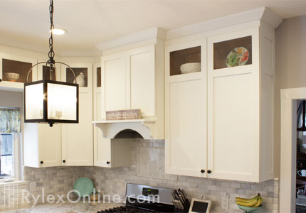 Custom Range Hood and Cabinets with Seed Glass Door Inserts