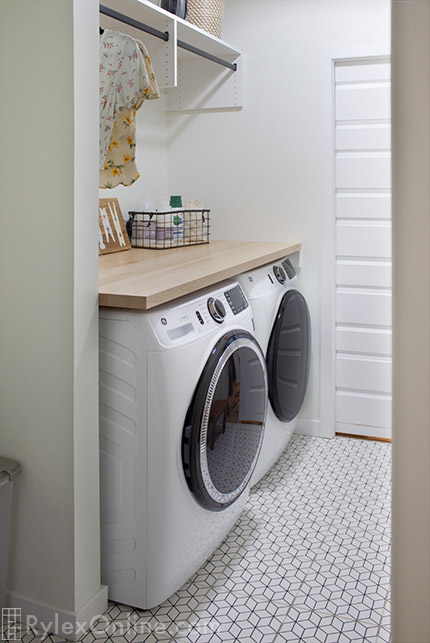 Compact Laundry Room with Butcher Block Countertop