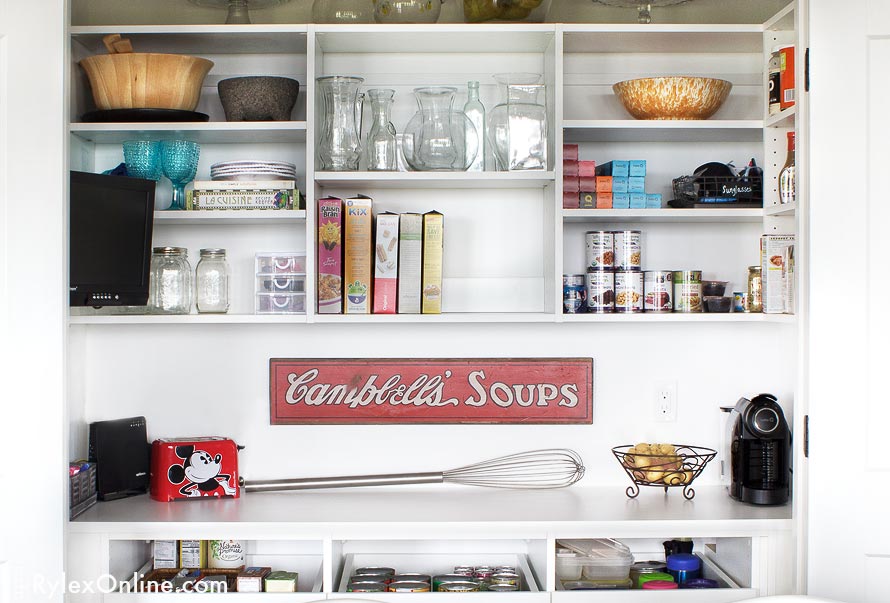 Organized White Pantry Shelves and Counter Close Up