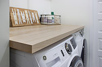 Compact Laundry Room with Butcher Block Counter