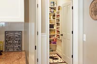 Walk-In Pantry with Sliding Baskets and Wall Spice Rack