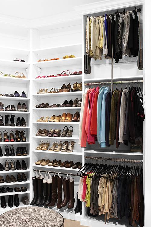 Airy Closet with Hanging Boot Storage and Pull Down Closet Rod