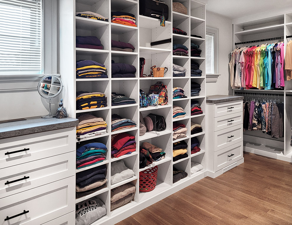 Primary Closet with Drawer Cabinets and Adjustable Shelves