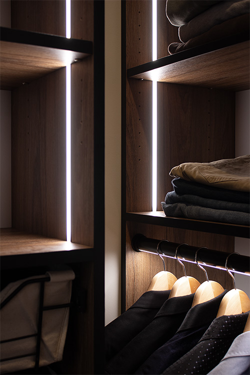 Stunning Closet Bathed in Lighting with Lighted Garment Rods