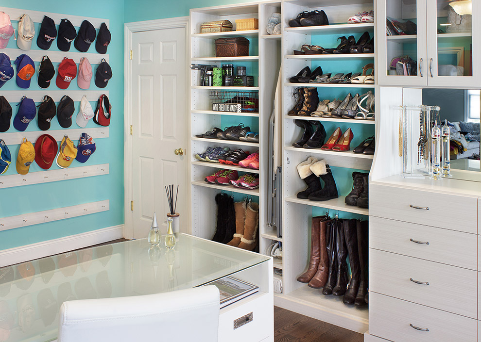 Closet with Ironing Board and Hanging Boot Storage and Cap Rack