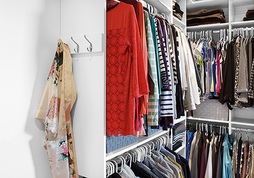 Master Closet Shelving with Robe Hooks Close Up