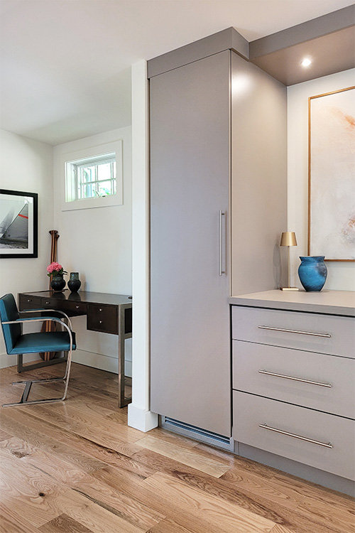 Custom Built-In Dual Wardrobes with Center Drawer Cabinet