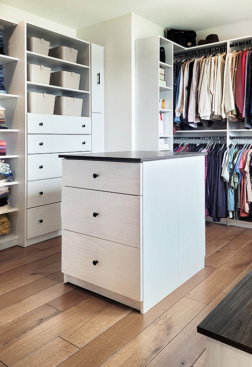 Luxury Custom Walk-In Closet with Island Cabinet and Adjustable Shelving