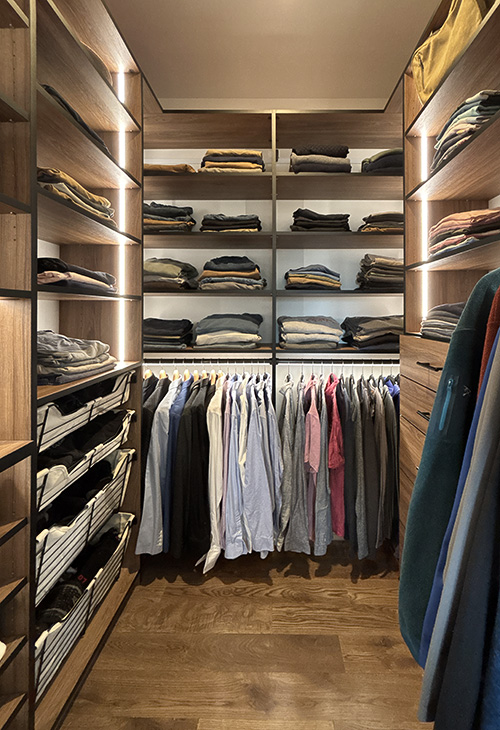 Dramatic Styled Men's Closet with Open Shelves and Sliding Baskets