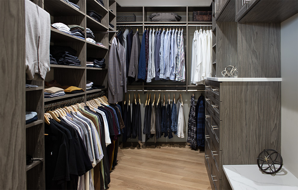 Sophisticated Spacious Men's Closet with Adjustable Open Shelves and Custom Cabinets