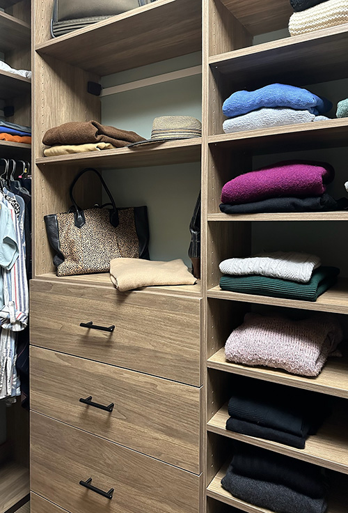 Organized Closet with Open Shelves and Drawers