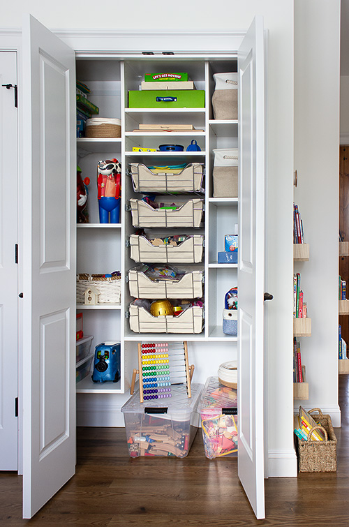 Playroom Closet with Sliding Baskets and Adjustable Shelves