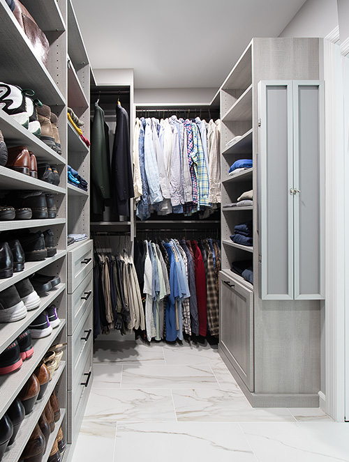 His and Hers Closet with Tilt Out Hamper and Trifold Pivoting Mirror