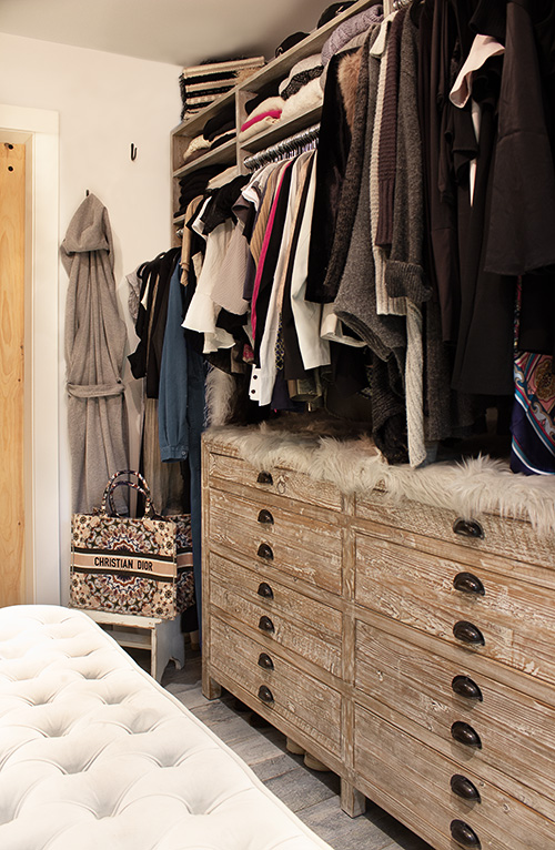 Luxury Primary Closet with Distressed Cabinet Finish