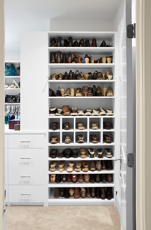 Master Walk-In Closet with Adjustable Shoe Shelves and Shoe Cubbies