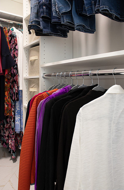 Custom Walk-In Closet with Adjustable Shelving and Hanging Organization