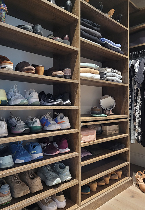 Luxury Primary Walk-In Closet with Adjustable Shoe Shelves, Hanging Space & Pull-Out Shelf