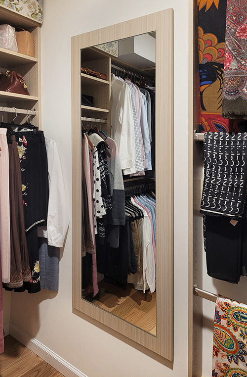 Luxury Closet with Full Length Mirror Reflects Light Enhancing the Brightness of the Summer Breeze Cabinet Finish