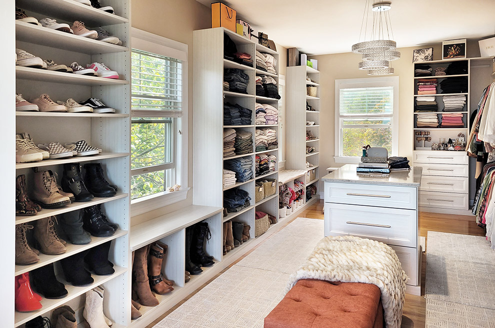 Luxury Walk-In Closet with Storage Cabinetry & Shoe Benches