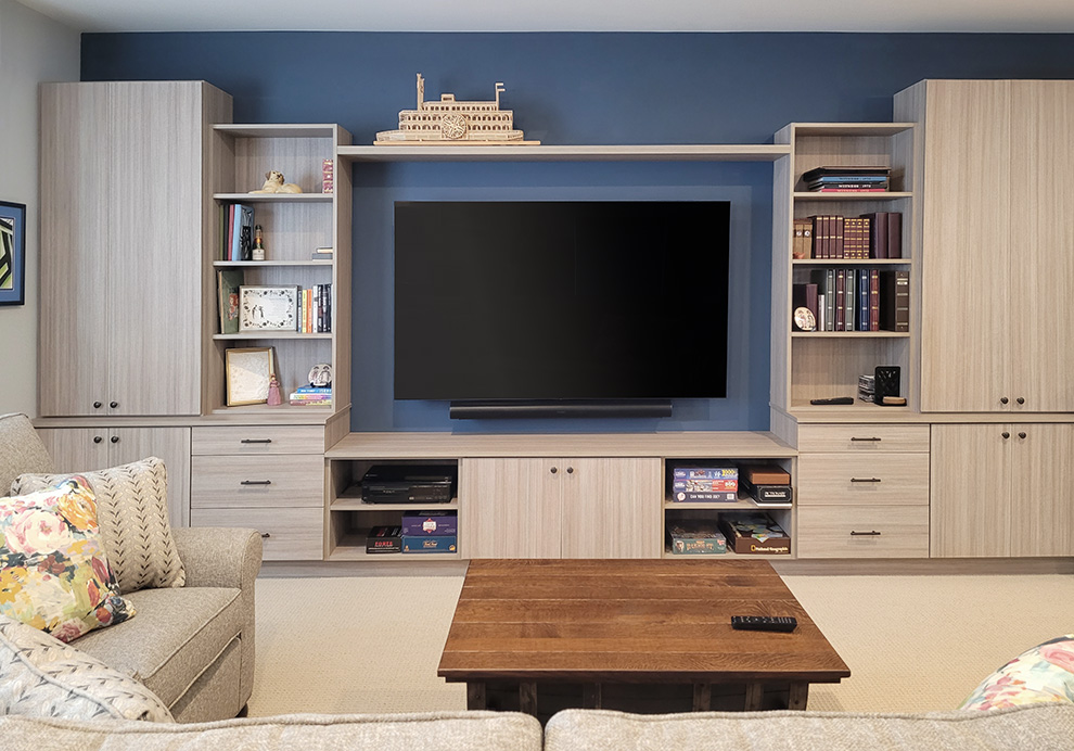 Multi-Faceted Custom Cabinets for Storage with Integrated Enterainment Center and Bookshelves