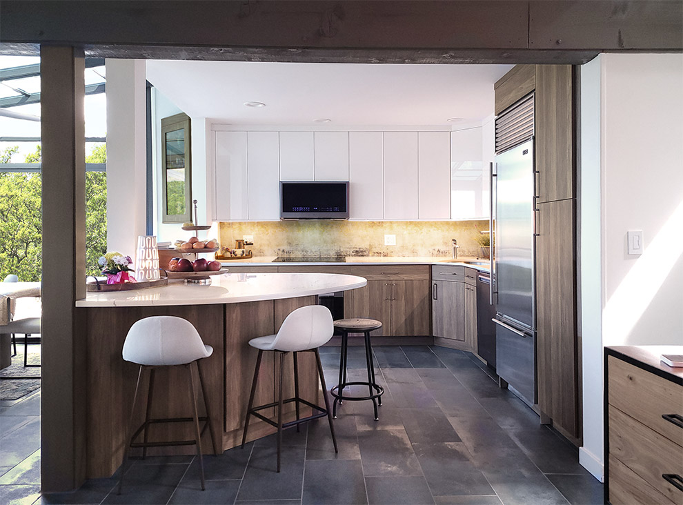 Glossy White Counters and Warm Wood Tone Kitchen