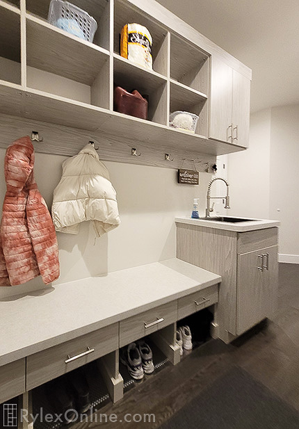 Galley Mudroom Design with Bench and Sink Cabinet