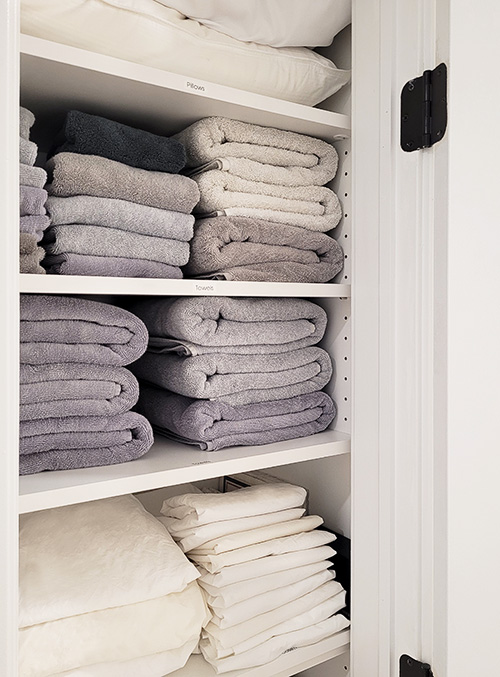 Linen Closet with Adjustable Wood Shelves Close Up