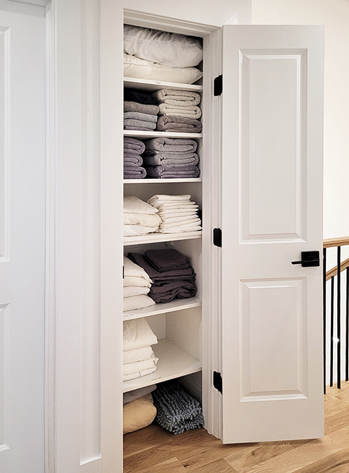 Hallway Linen Closet with Adjustable Wood Shelves