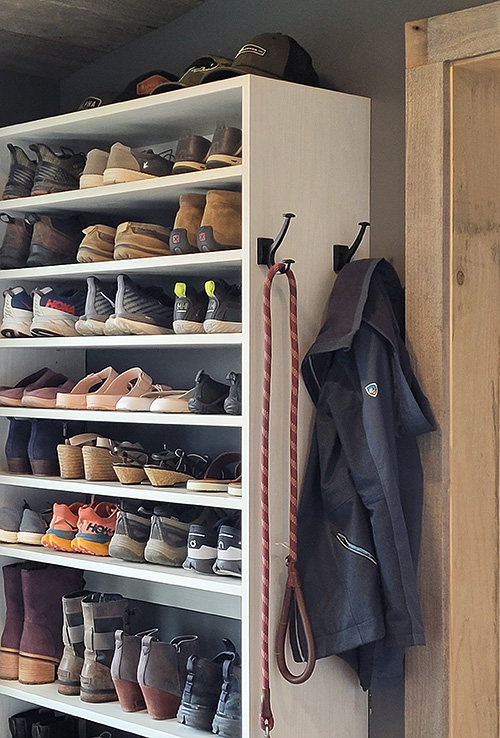 Mudroom Thoughtfully Designed Cabinet Compartments with Hooks and Adjustable Shoe Shelving