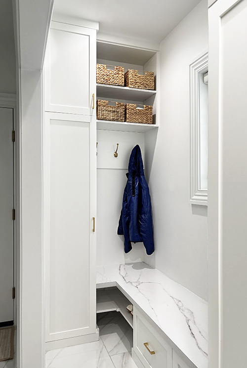 White Mudroom with Bench and Cabinets with Open Shelves