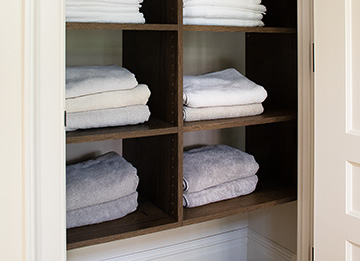 Custom Linen Closet with Brown Halifax Oak Shelves