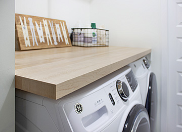 Compact Laundry Room with Butcher Block Counter