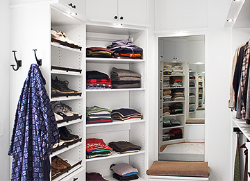 His and Her Closets with Storage Bench