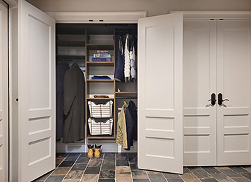 Custom Brown Halifax Oak Entry Closet with Adjustable Shelving and Sliding Baskets