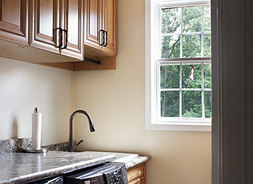 Efficient Laundry Room with Under Counter Trash Can