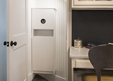 Recycling Cabinet with Drawer Tucked by the Stairs