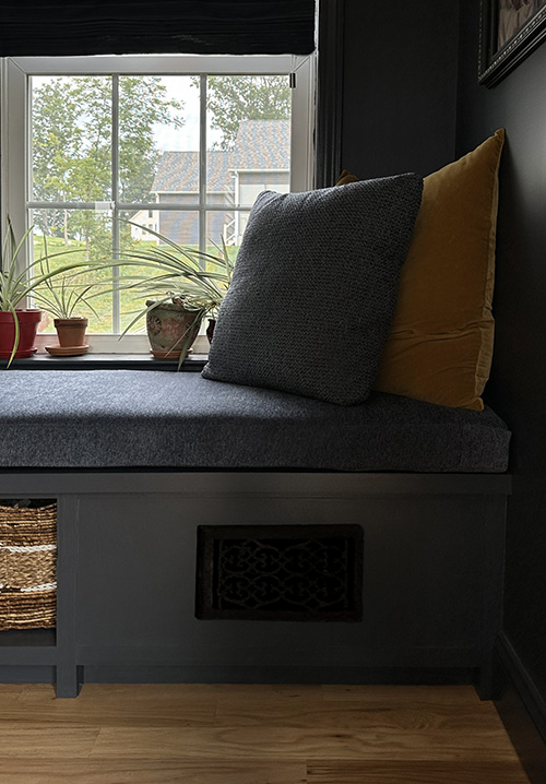 Window Seat Bench with Baskets and Rerouted Heating Vent to Ensure Warmth